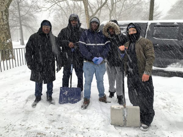 This NYC Department of Citywide Administrative Services team worked on Sunday to keep the street and walkways clear around the NYC Emergency Management headquarters in Downtown Brooklyn. Photo: Mary Frost, Brooklyn Eagle