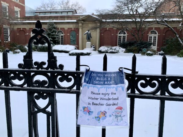 Plymouth Church in Brooklyn Heights invited youngsters to build snowmen on the pristine snow in Beecher Garden. Photo: Mary Frost, Brooklyn Eagle