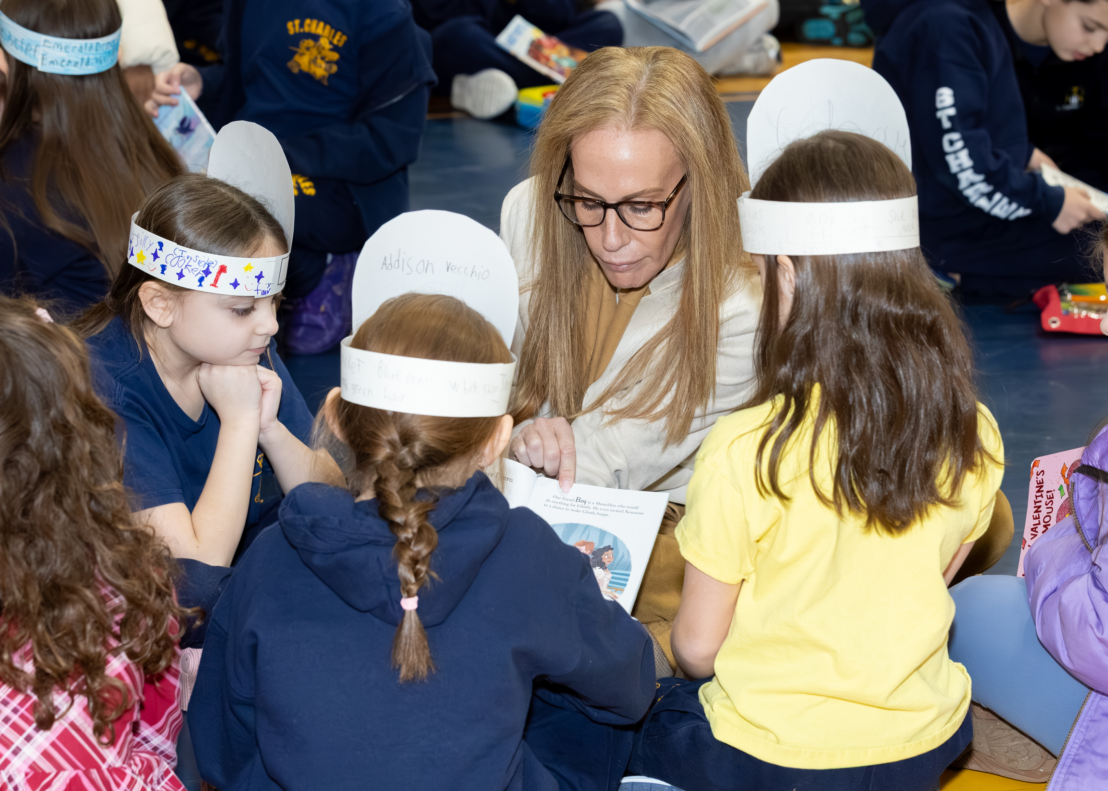 Jann Amato, regional superintendent of the Catholic School Region of Staten Island reads to first and second graders as part of Catholic Schools Week at the St. Charles School in Oakwood on Wednesday, Jan. 28, 2026 (Advance/SILive.com | Jason Paderon)