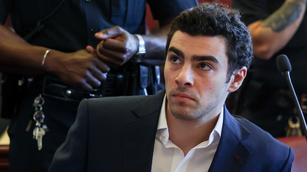 Luigi Mangione appears in Manhattan Criminal Court for an evidence hearing, Thursday , Dec....