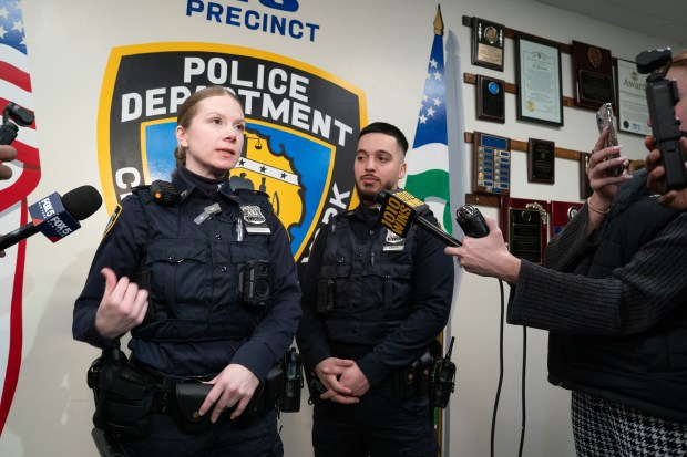 NYPD Officer Freddy Cerpa and Officer Megan Ficken are pictured at the 43rd Precinct stationhouse in the Bronx on Thursday, January 29, 2026. (Barry Williams/ New York Daily News)
