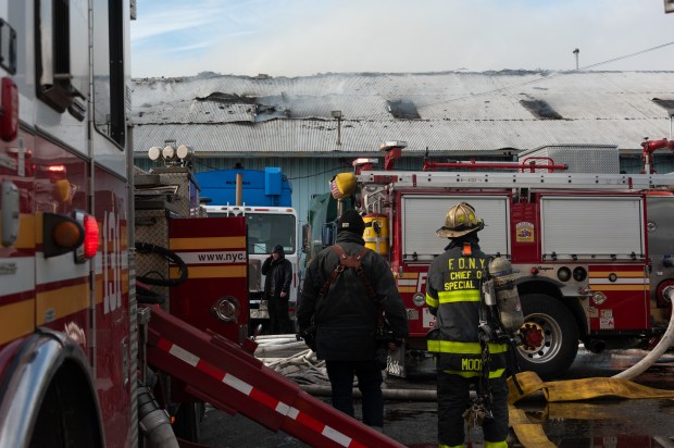 Firefighters battle a large warehouse fire on Columbia St. in Red Hook, Brooklyn, on Wednesday, Jan. 21, 2026. (Gardiner Anderson / New York Daily News)