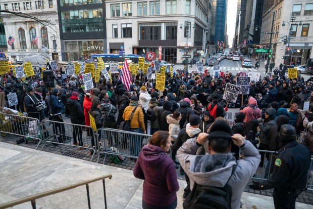 Anti-Donald Trump protesters gather near the 42nd St. library in Midtown Manhattan on Tuesday, January 20, 2026 in New York City. (Barry Williams/ New York Daily News)