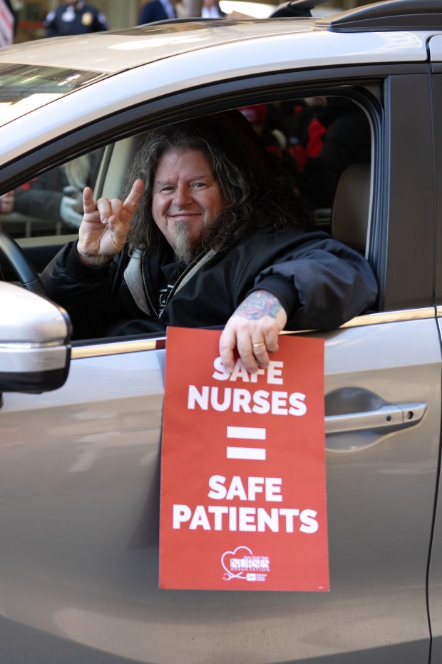 A driver shows his support as nurses from New York Presbyterian walk the picket line outside the Washington Heights medical center on Monday, January 12, 2026 in New York. (Barry Williams/ New York Daily News)