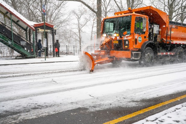 Snow plow rolling down Broadway in the Bronx on Sunday, January 25, 2026. (Theodore Parisienne / New York Daily News)