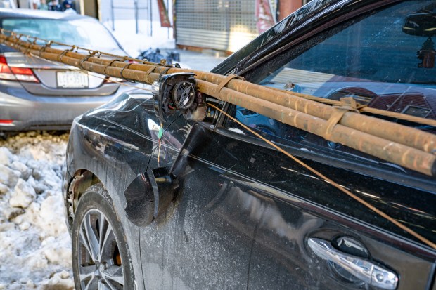 A bundle of communication wires that fell from the elevated subway tracks above Fulton St. between Linwood St. and Elton St. in Cypress Hill, Brooklyn, damaged six cars on Friday, Jan. 30, 2026. (Theodore Parisienne / New York Daily News)