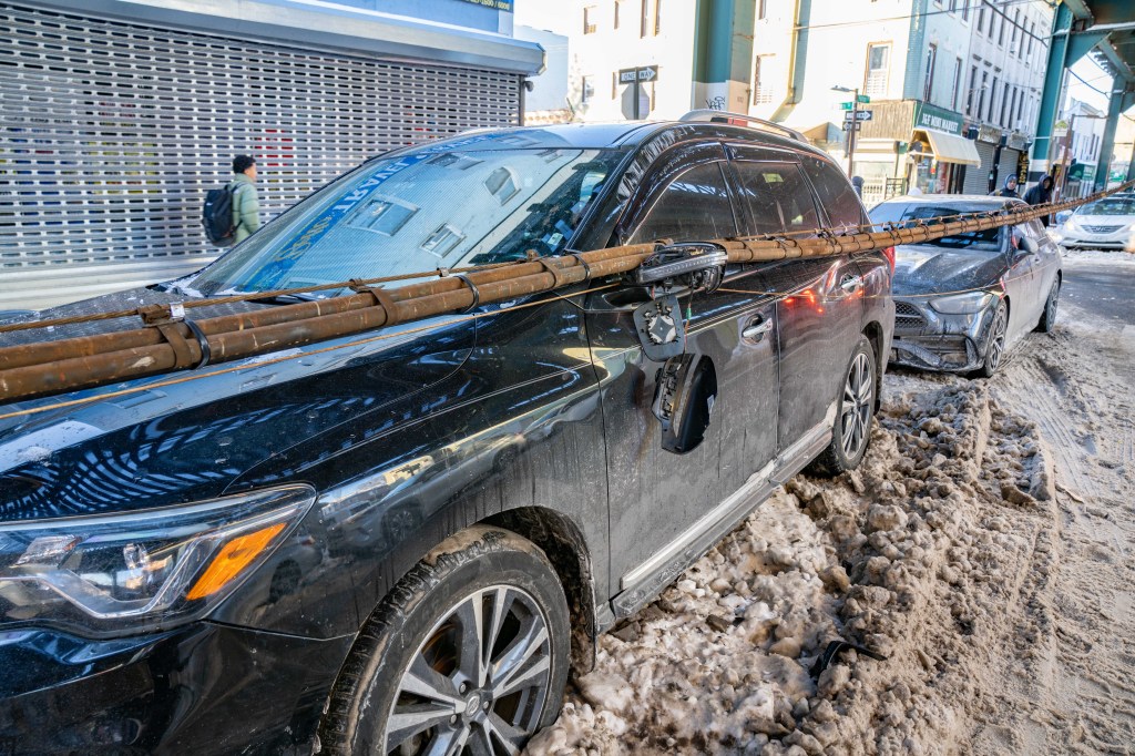 Frigid cold causes Brooklyn cable to fall off elevated MTA subway line onto cars below