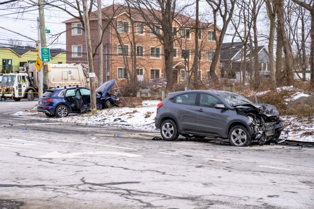 The aftermath of a crash involving a grey Honda HRV SUV and a blue Audi Q5 SUV at the intersection of Forest Hill Rd. and Rockland Ave. in Staten Island on Friday, Jan. 2, 2026. (Theodore Parisienne / New York Daily News)