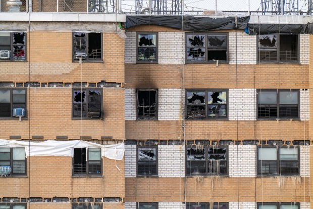 Emergency crews respond after a massive fire, prompted by a gas explosion, tore through the top of a Bronx NYCHA high-rise building on Bivona St. near Reeds Mill Lane in the Bronx early Saturday, Jan. 24, 2026. (Theodore Parisienne / New York Daily News)