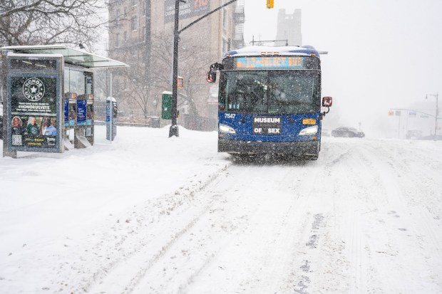 A MTA bus makes its way through the snow in the Bronx on Sunday, January 25, 2026. 