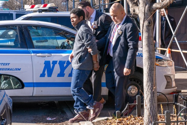 Deovryion Ray, accused of murdering Dashanna Donovan, is pictured in police custody leaving the NYPD's 115th Precinct stationhouse in Queens on Thursday, Jan. 15, 2026. (Theodore Parisienne / New York Daily News)
