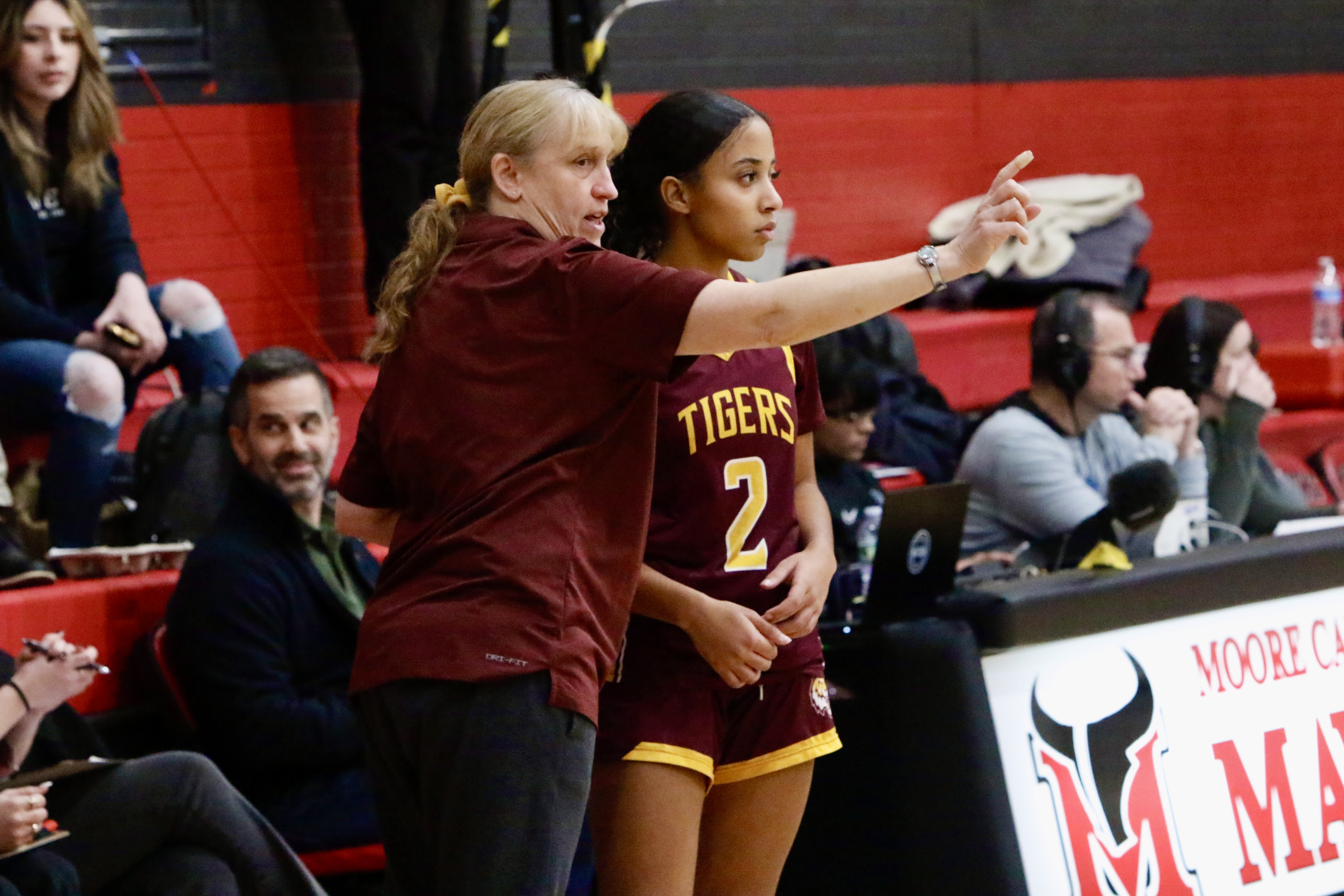 Staten Island Academy head coach Sandy Litkenhaus instructs Rita Moschella during a Borough President's Cup game against New Dorp on Jan. 23, 2025.
