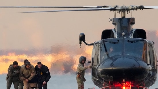 DEA (Drug Enforcement Administration) agents move captured Venezuelan President Nicolas Maduro from a helicopter, as Maduro heads towards the Daniel Patrick Manhattan United States Courthouse for an initial appearance to face U.S. federal charges (REUTERS)