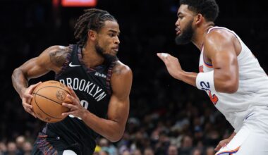 Brooklyn Nets center Nic Claxton (33) is guarded by New York Knicks center Karl-Anthony Towns (32) during the second half at Barclays Center.
