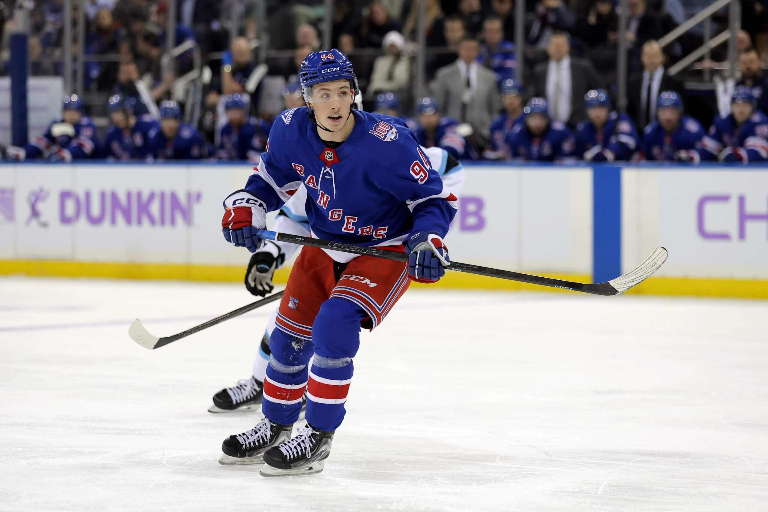 Rangers forward Gabe Perreault pivots on the ice with a Utah player behind him.