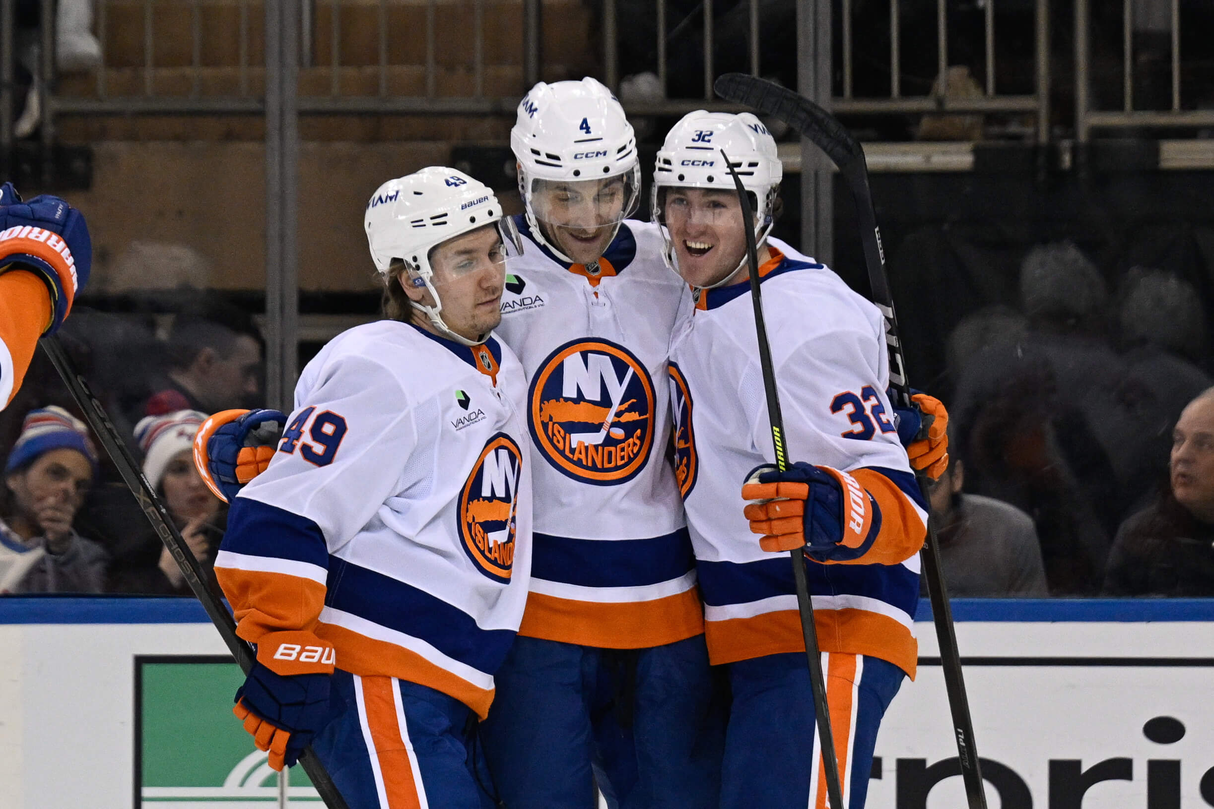 Carson Soucy gets hugs from his new Islanders teammates after scoring.