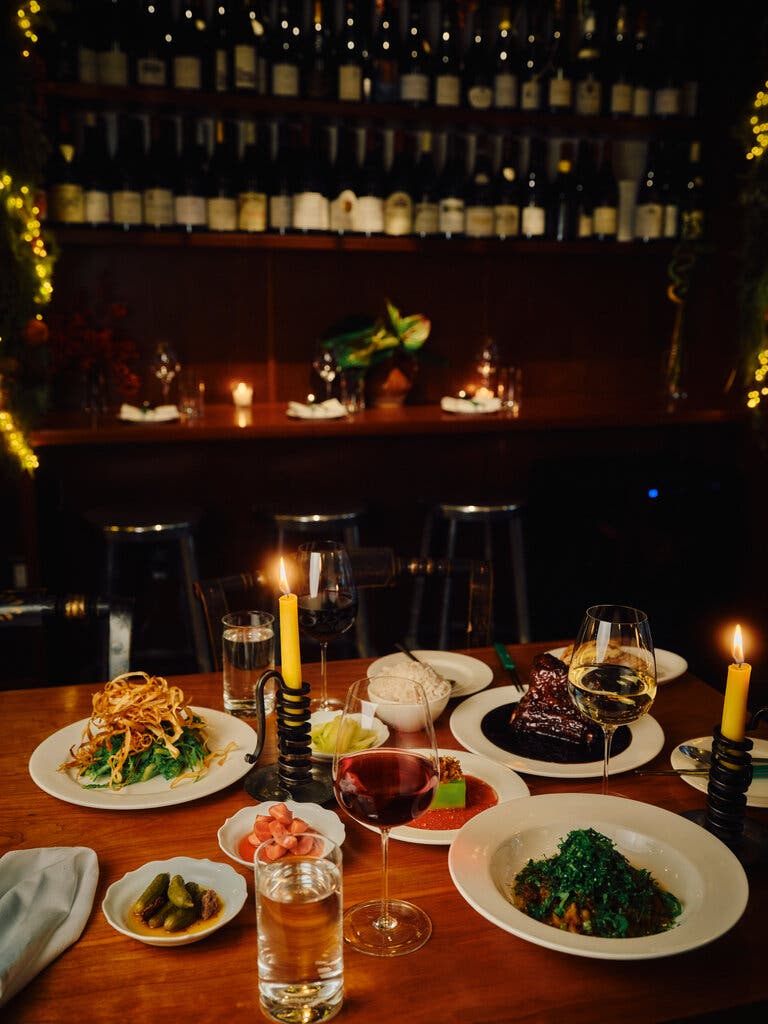 A variety of dishes sit on a table at the restaurant Lei.