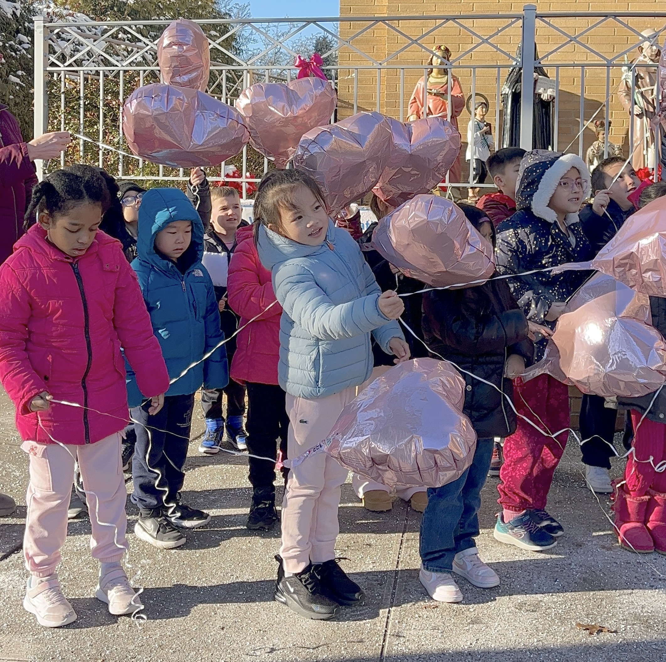First grade classmates release balloons at the dedication for Anheli Vasquez-Trinidad held on Tuesday, Jan. 20 at Father Vincent Capodanno Catholic Academy.  (Advance/SILive.com|Jan Somma-Hammel)