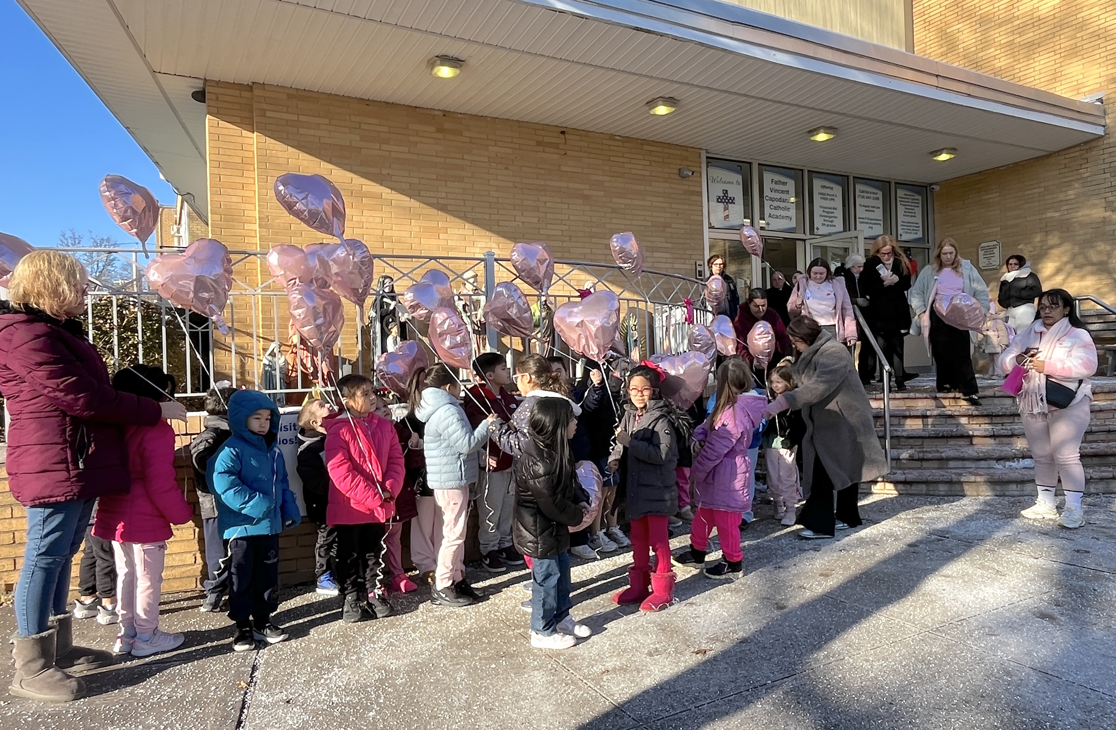 First grade classmates release balloons at the dedication for Anheli Vasquez-Trinidad, held on Tuesday, Jan. 20, at Father Vincent Capodanno Catholic Academy.  (Advance/SILive.com|Jan Somma-Hammel)
