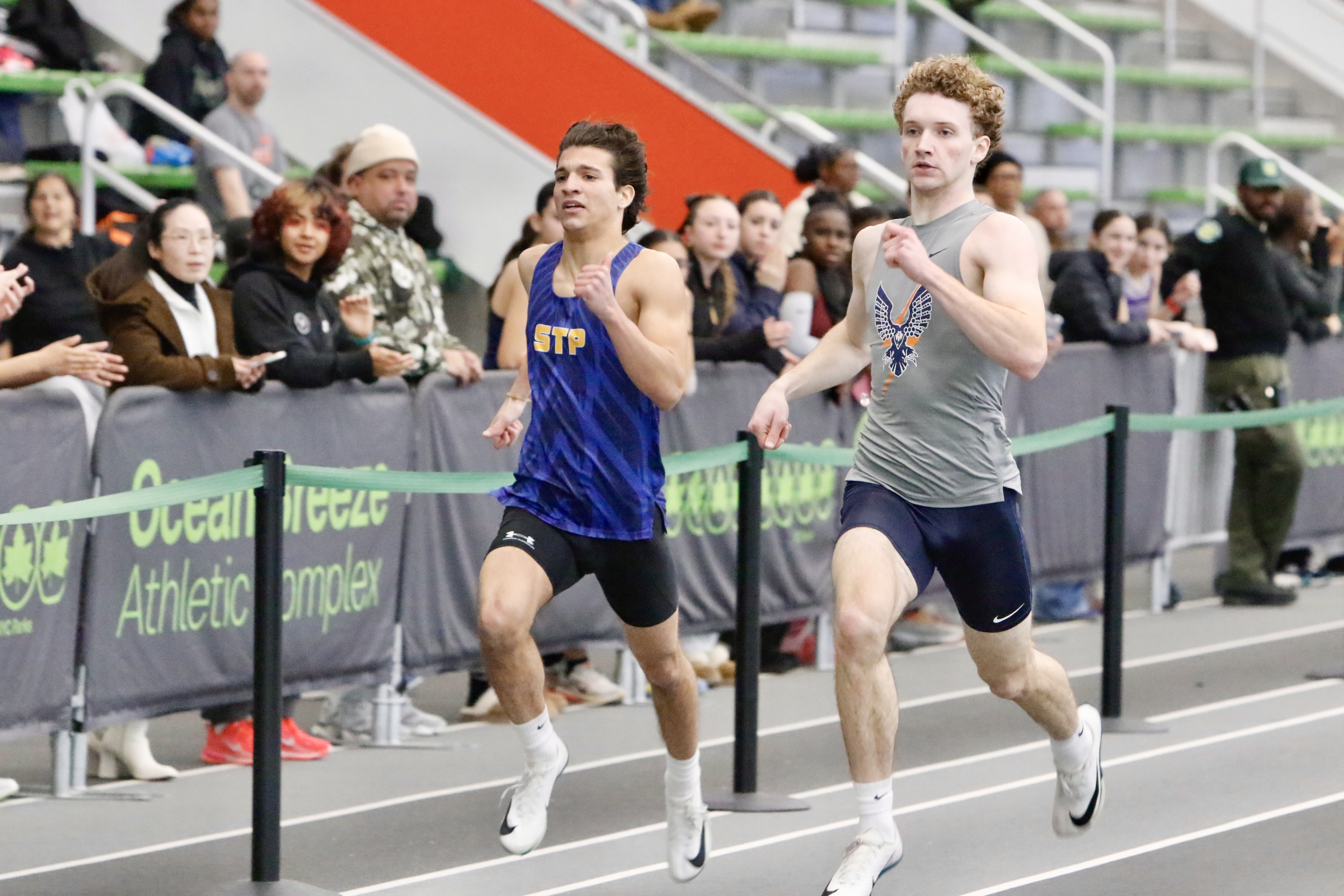 300 meter champion Jeremy Walters of Susan Wagner and third-place finisher Vincent Damato of St. Peter's battle it out at the Staten Island High School Indoor Track and Field Championship on Jan. 18, 2026.