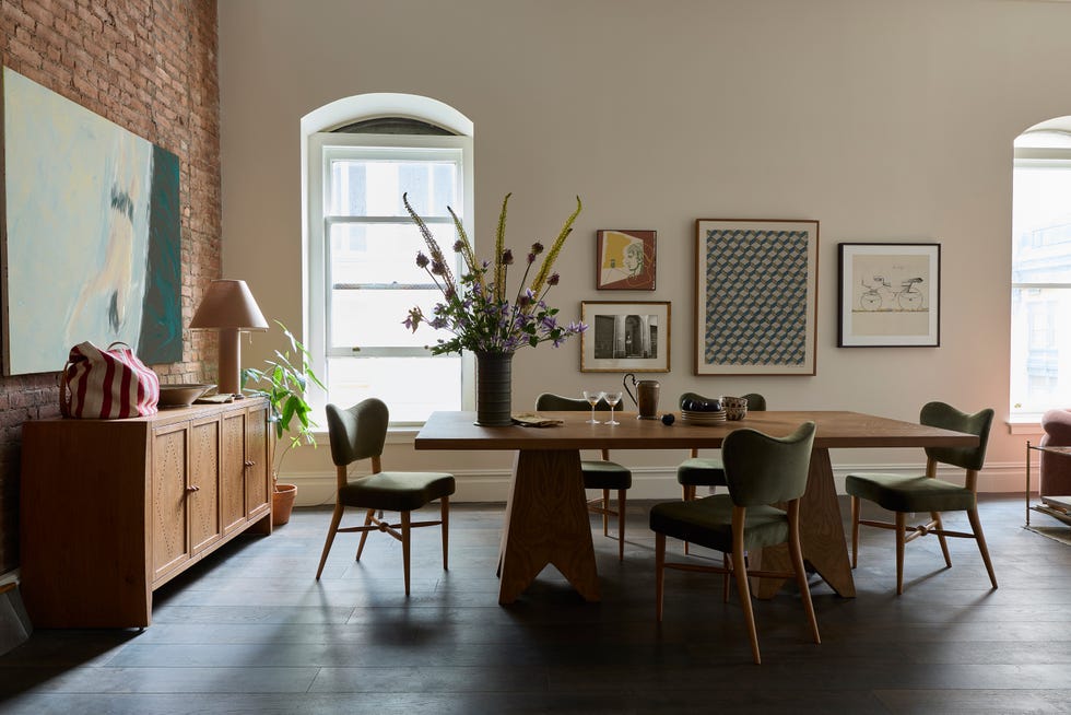 Interior dining area with wooden furniture and decorative elements.
