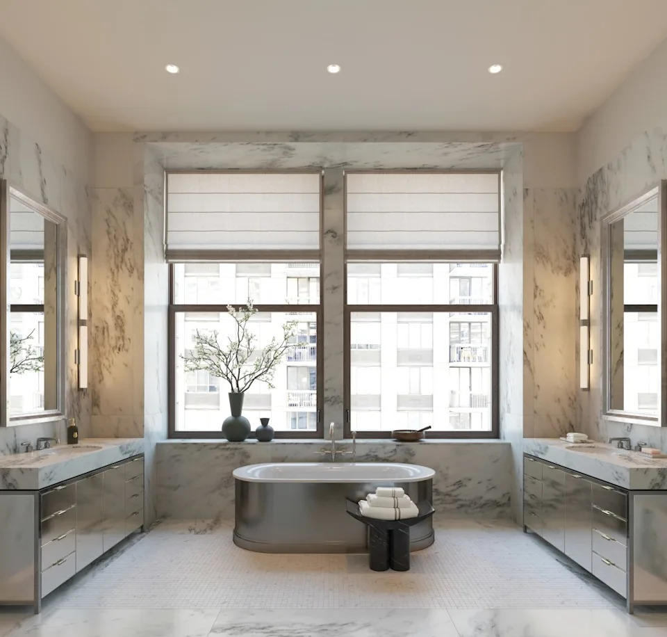 Marble accents line the primary bath. Courtesy of The Flatiron Building