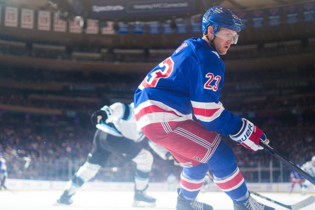 Adam Fox of the New York Rangers skating against the Utah Mammoth at Madison Square Garden.