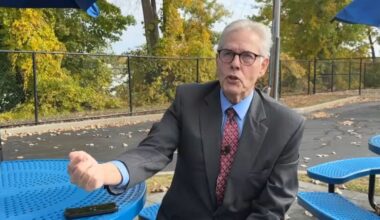 ralph ambrosio sits at a park table and speaks