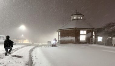 angola rest stop on thruway snowed in, with someone plowing walkway