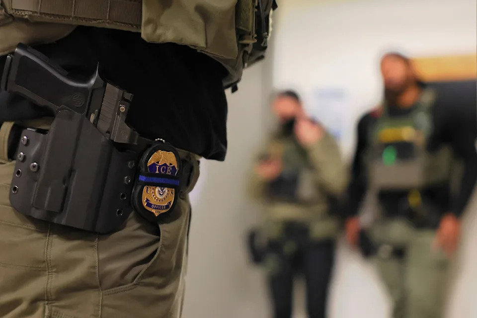 Michael M. Santiago/Getty Images - PHOTO: An ICE officers badge is seen as federal agents patrol the halls of immigration court at the Jacob K. Javitz Federal Building on June 10, 2025 in New York City.