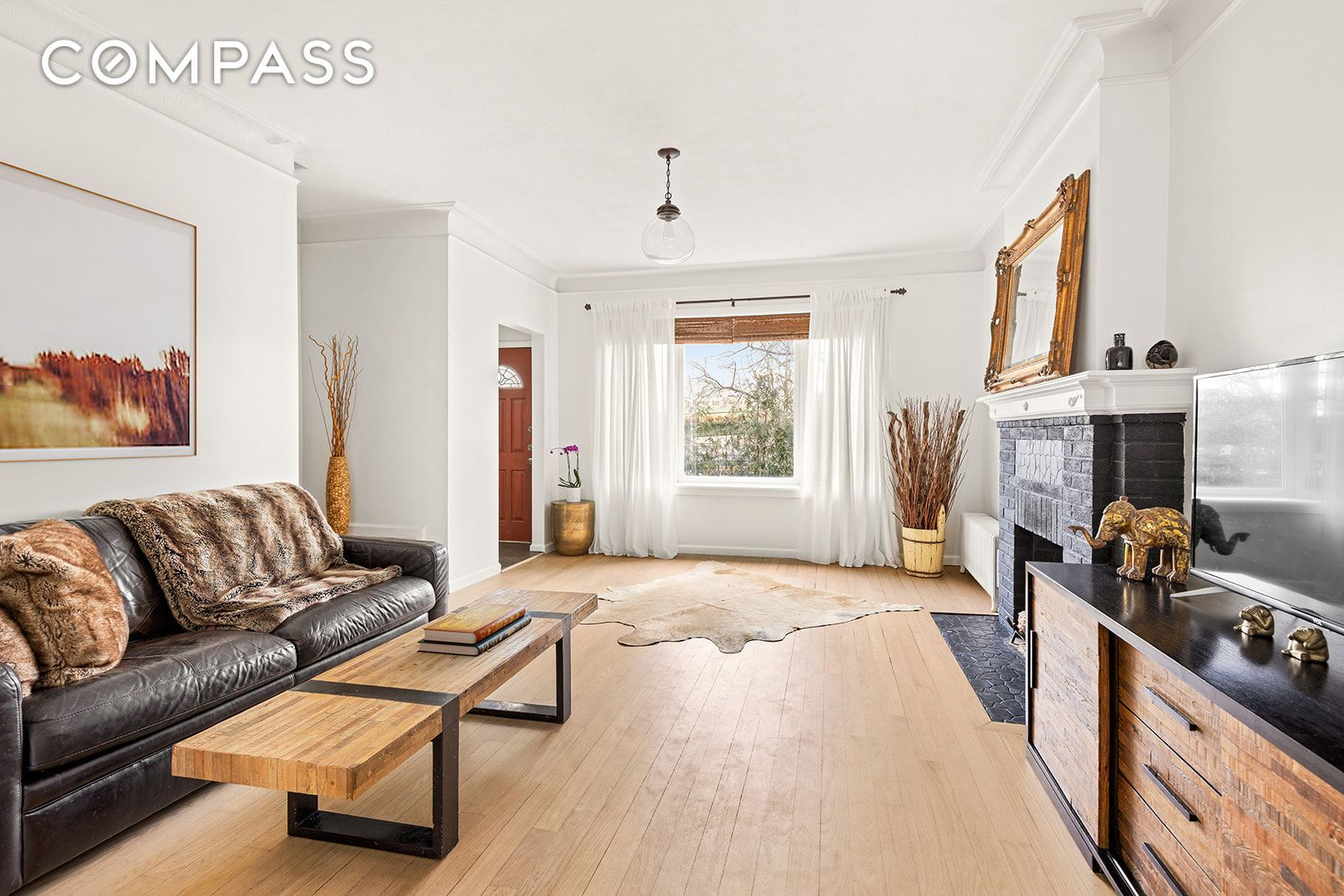 living room with tiled mantel