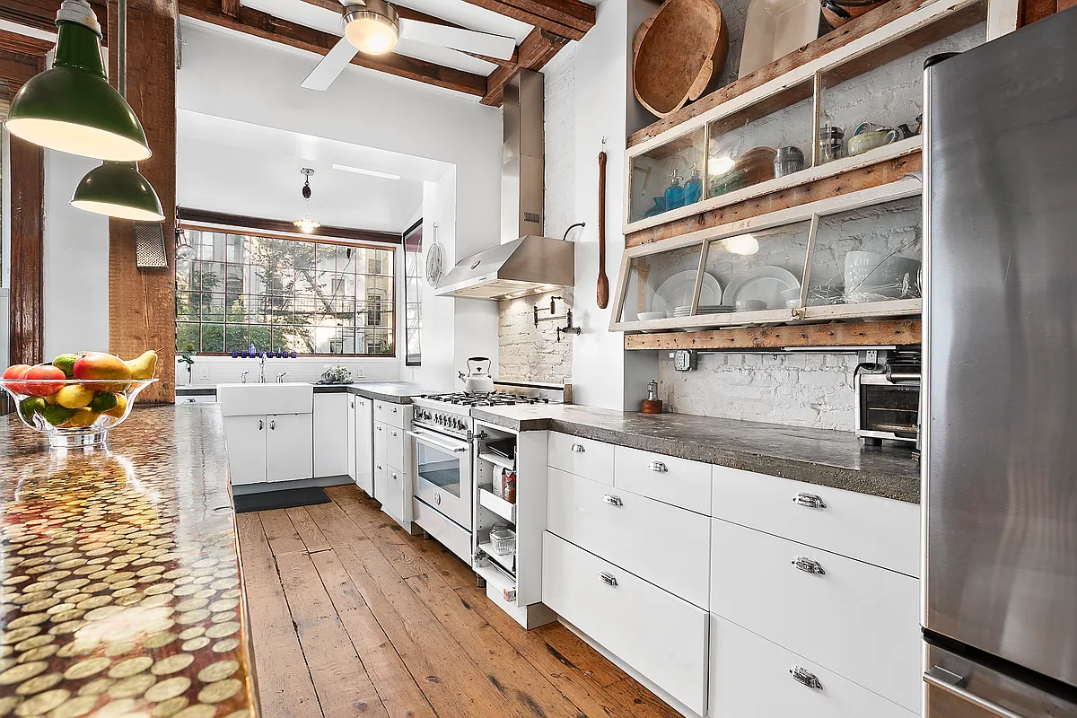 kitchen with white cabinets and a beamed ceiling
