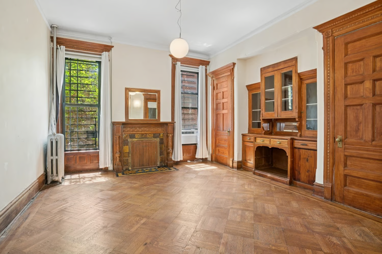 a dining room with a built-in china cabinet