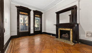 parlor with mantel and stained glass
