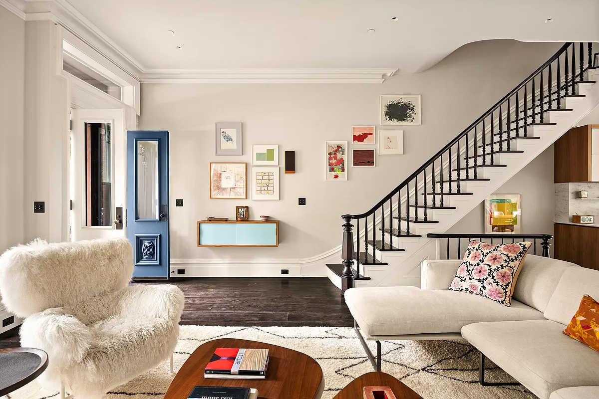 parlor with a view to the front door and a staircase