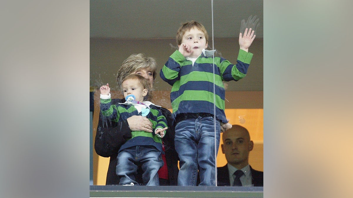 Brooklyn Beckham and his brother, Romeo, watching David Beckham play soccer in Spain in December 2003.