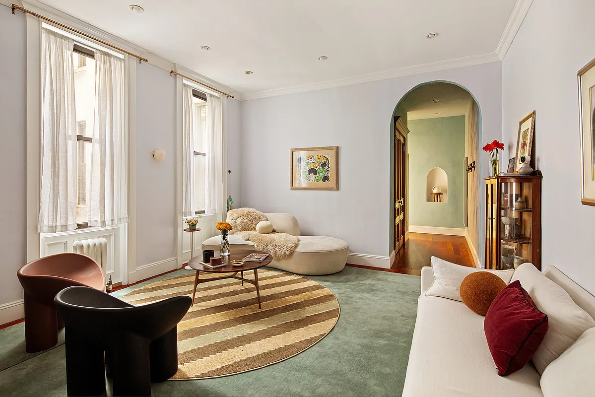 living room with arched doorway, recessed lighting