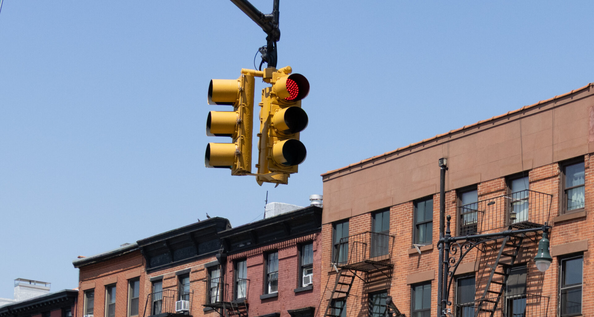 red light on atlantic avenue with buildings in the background