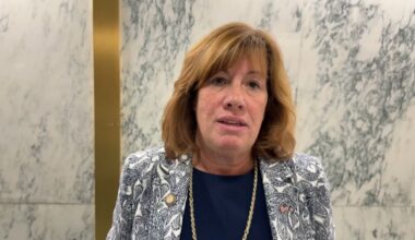 assemblywoman marianne buttenschon speaks in a hallway in Albany