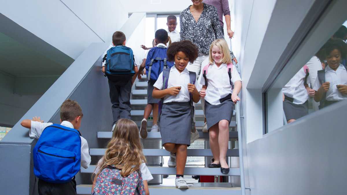 charter school students walking in stairway