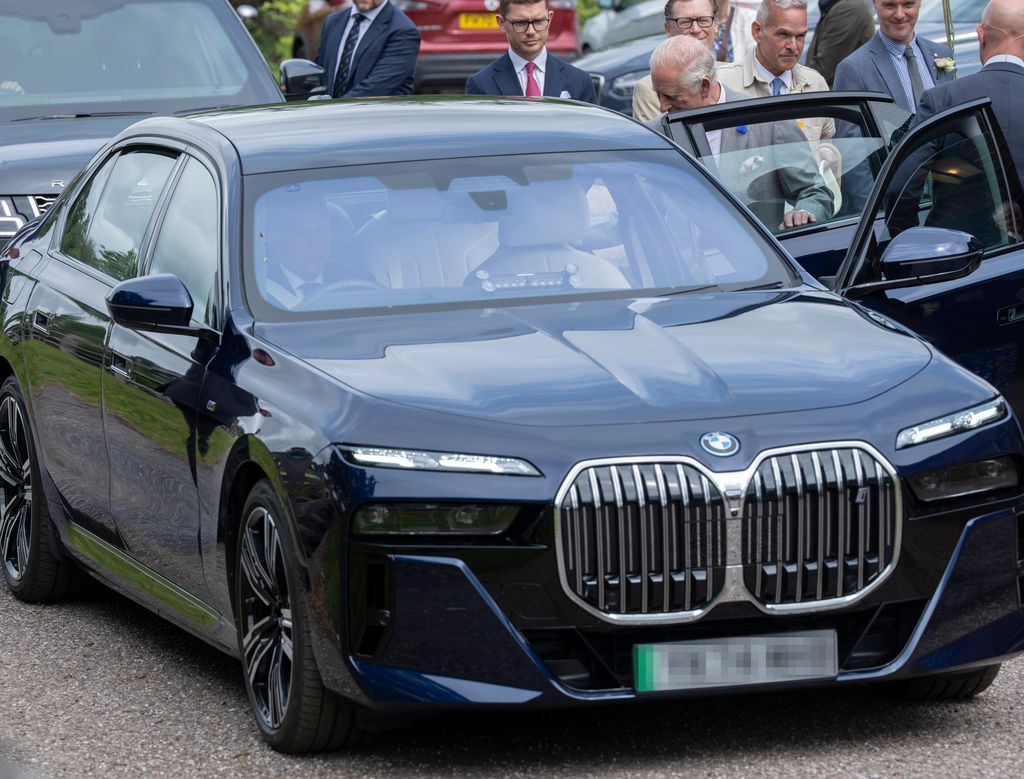King Charles III with an electric BMW car used to attend the Royal Windsor Flower Show at Windsor Great Park on June 7, 2025 