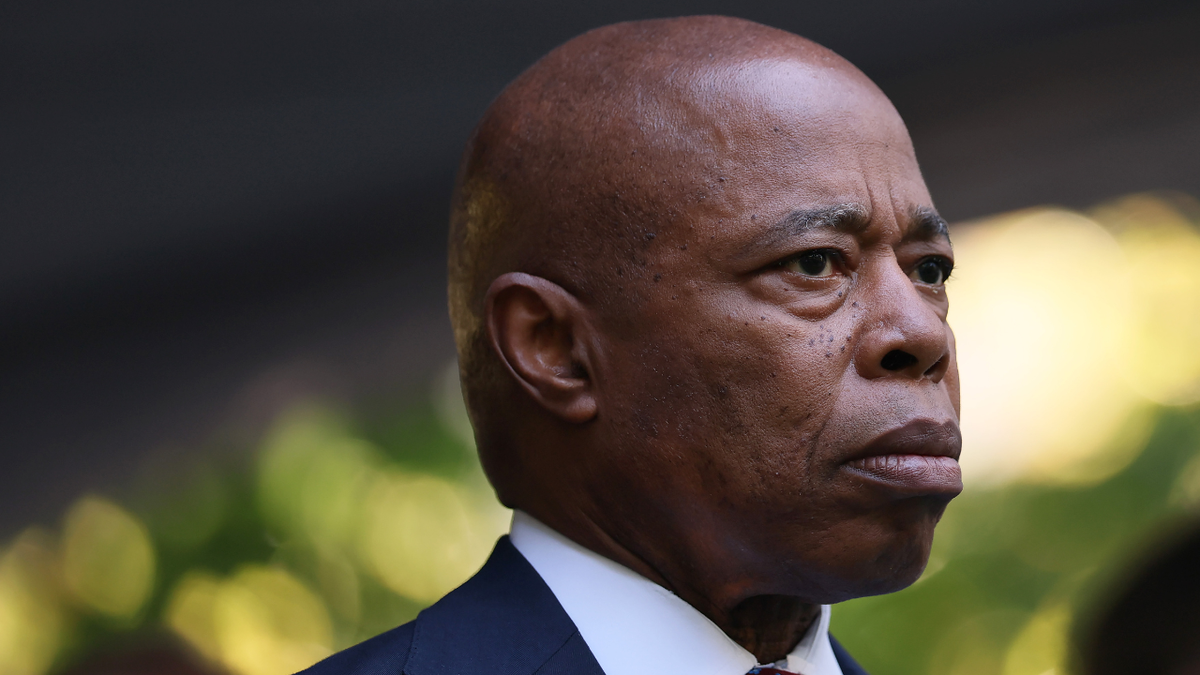 NYC Mayor Eric Adams listens during a 9/11 memorial service