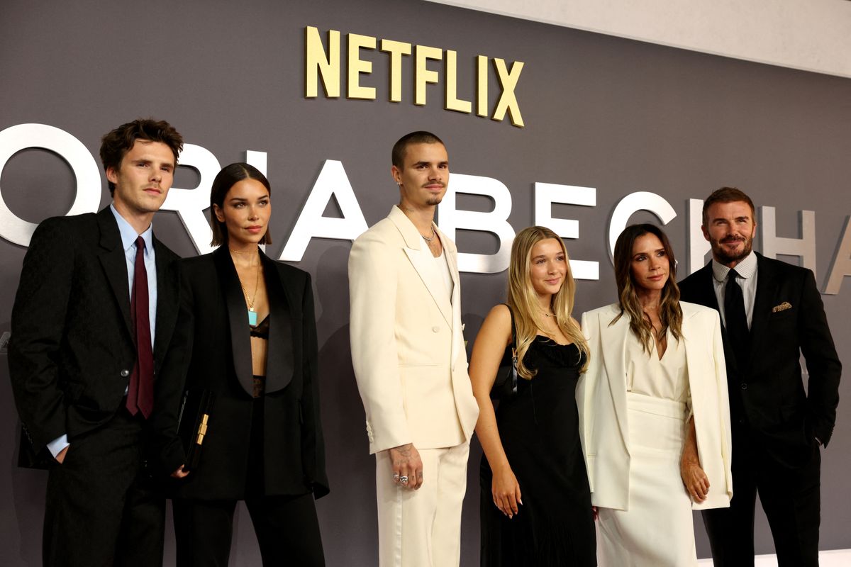 David Beckham and Victoria Beckham pose alongside their children, Harper Beckham, Romeo Beckham, and Cruz Beckham, upon arrival to attend the world premiere of the three-part documentary series 'Victoria Beckham'