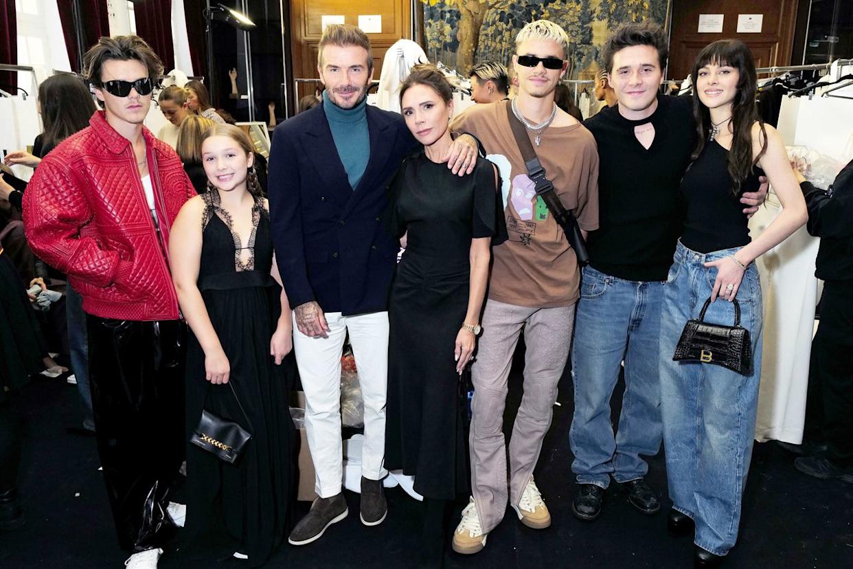 Darren Gerrish/WireImage for Victoria Beckham  Cruz Beckham, Harper Beckham, David Beckham, Victoria Beckham, Romeo Beckham, Brooklyn Beckham and Nicola Peltz Beckham in 2022.
