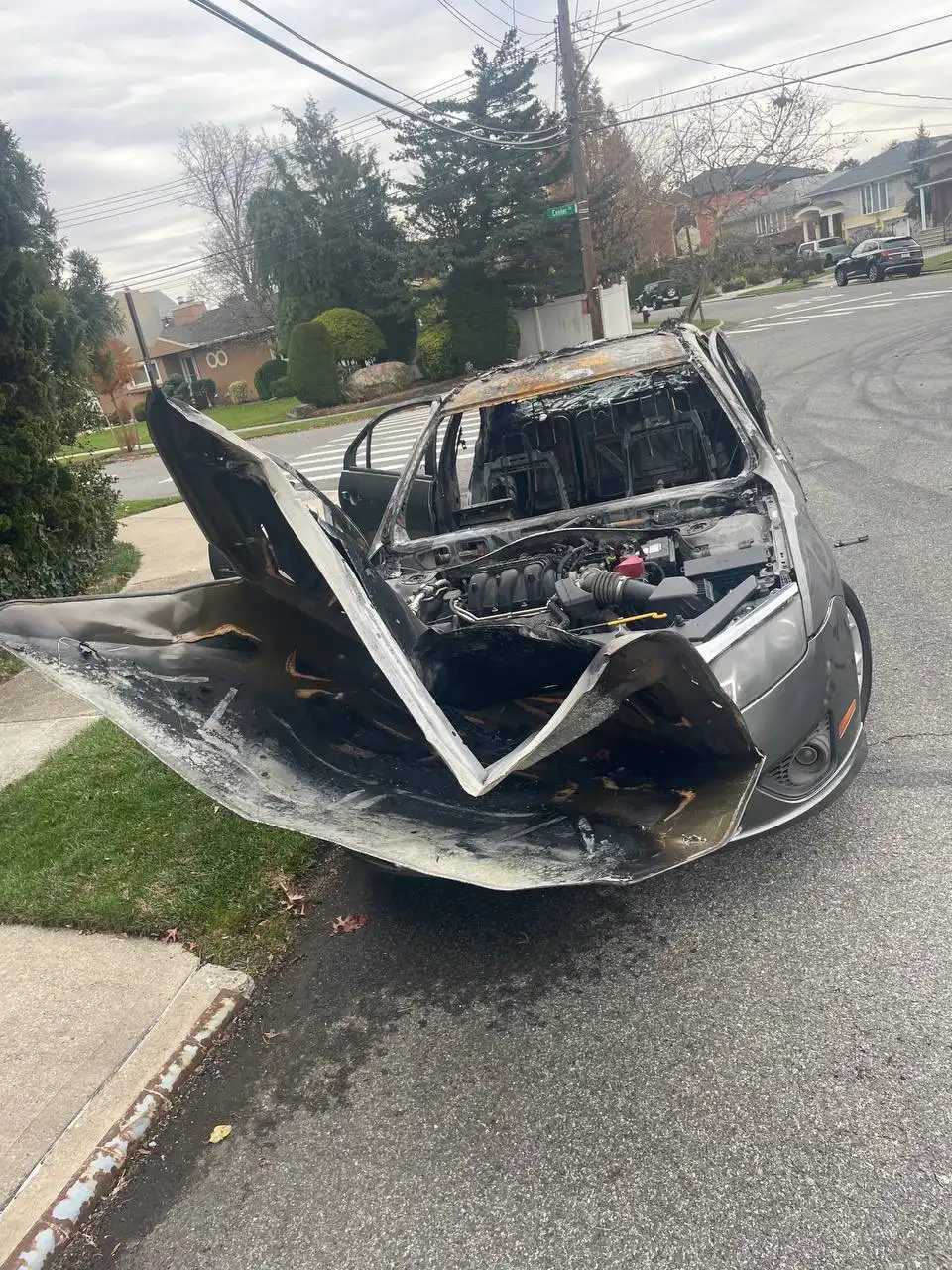 A Malba homeowner’s company car was destroyed when the mob set it alight with fireworks. 