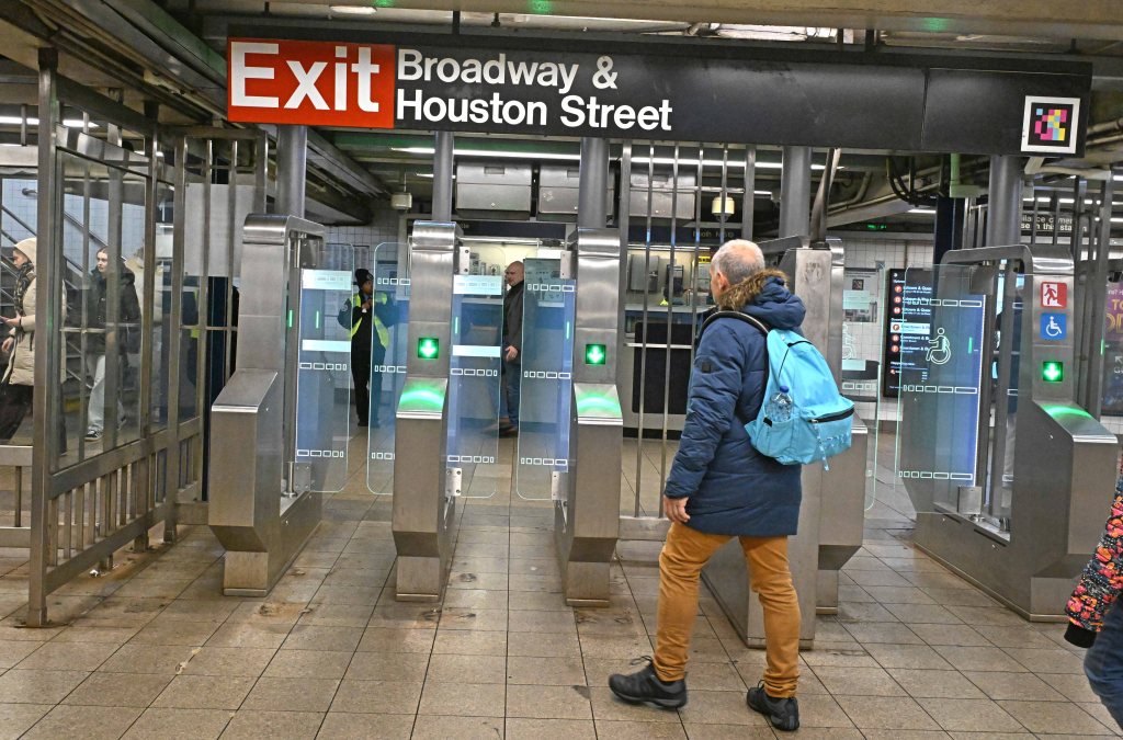 New glass doors used as turnstiles for the subway entrance at Broadway-Lafayette station are part of an MTA pilot program to stop fare evaders.