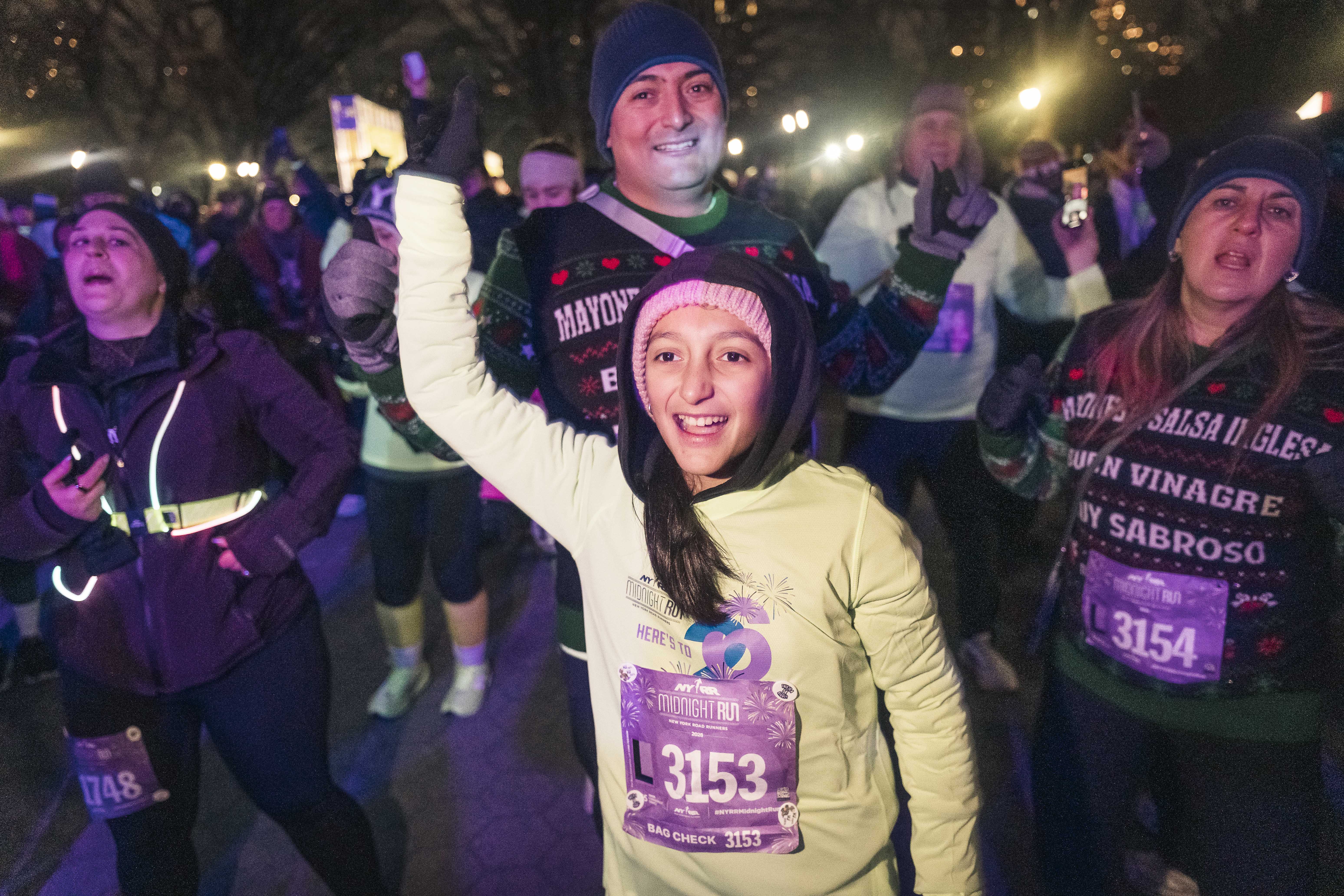 Runners cheer in anticipation for the NY Road Runners Midnight Run.