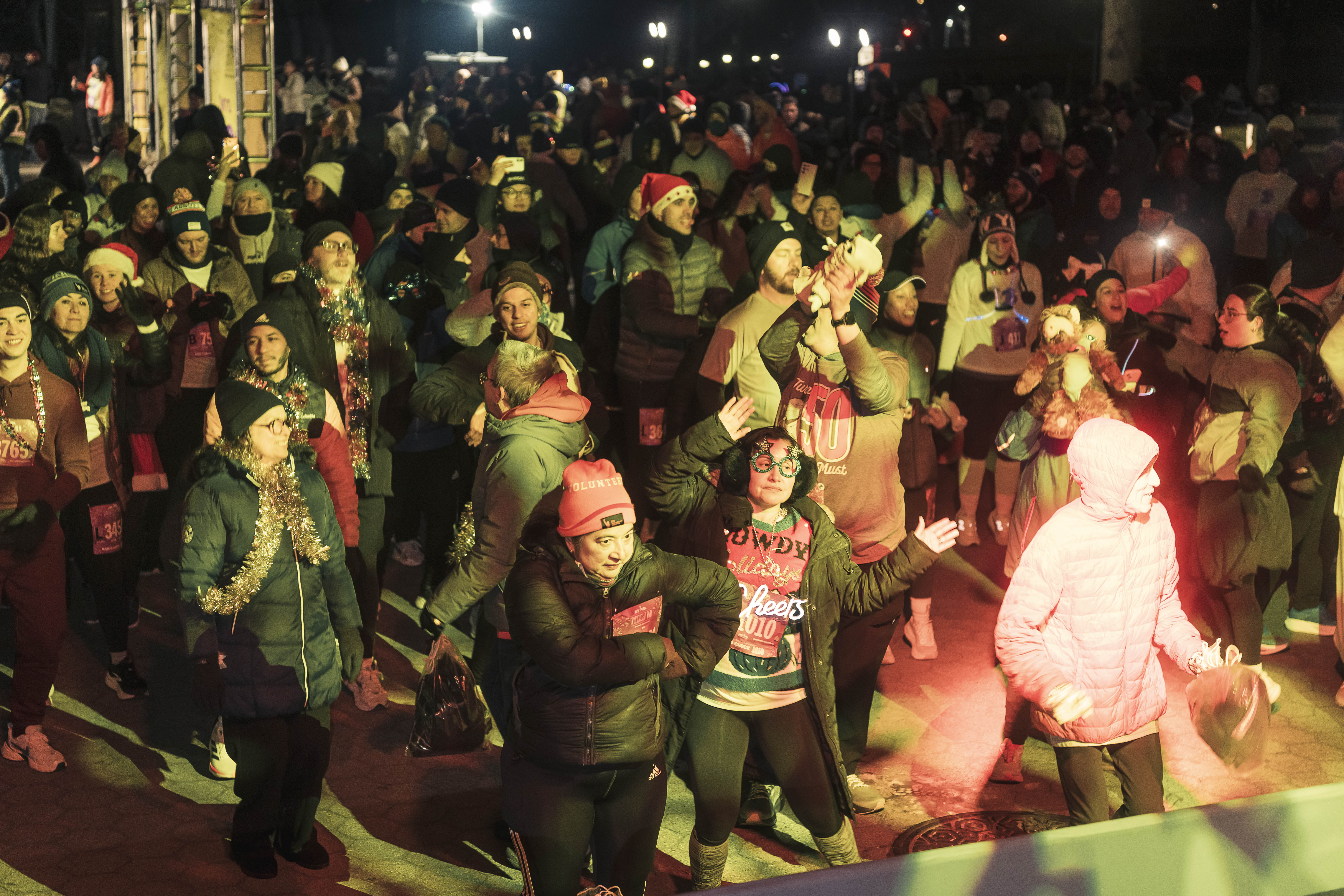 Runners groove to the beat during pre-race festivities at the Naumburg Bandshell in Central Park.