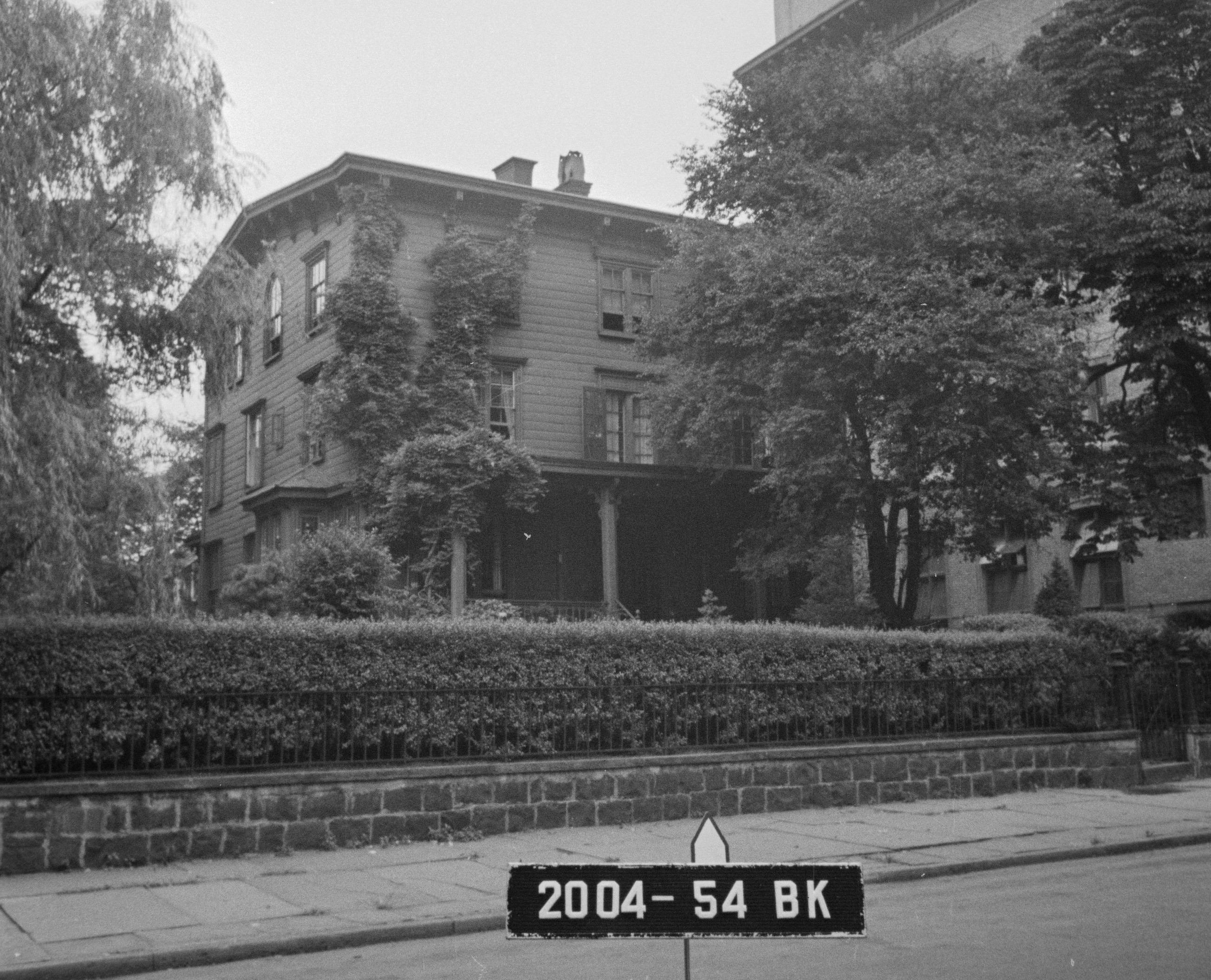 black and white photo of a clapboard house