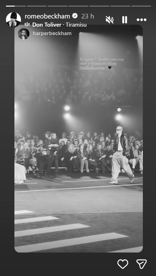 fashion show featuring a model walking on the runway